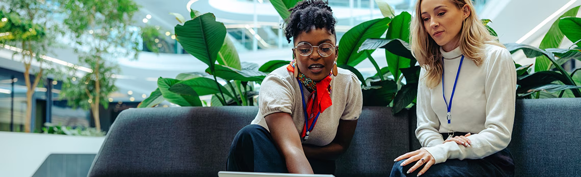 two people working with a laptop together
